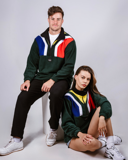 Two people wearing a unisex green south african supporters flag jersey