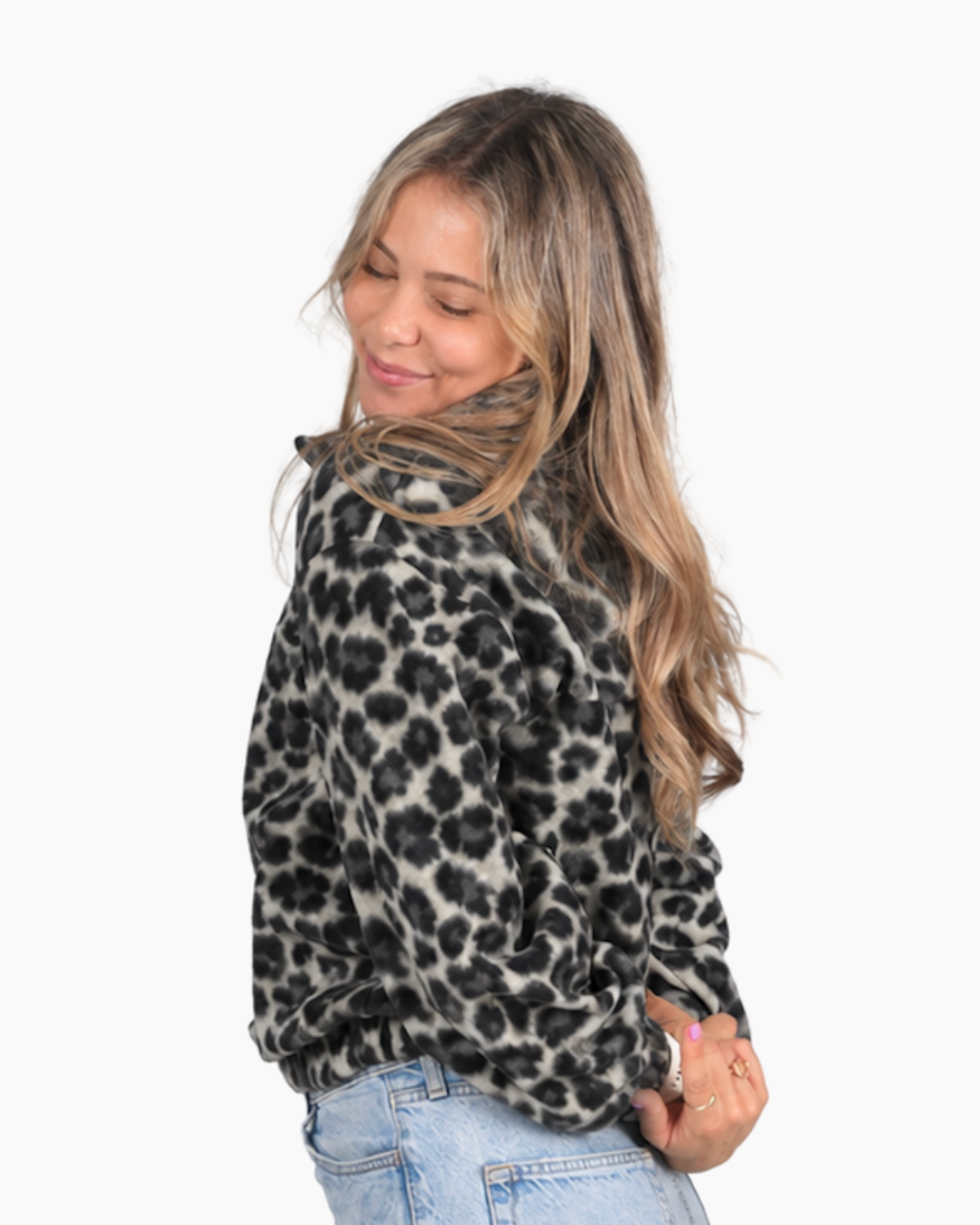 Female wearing a Leopard print retro jersey side view in studio