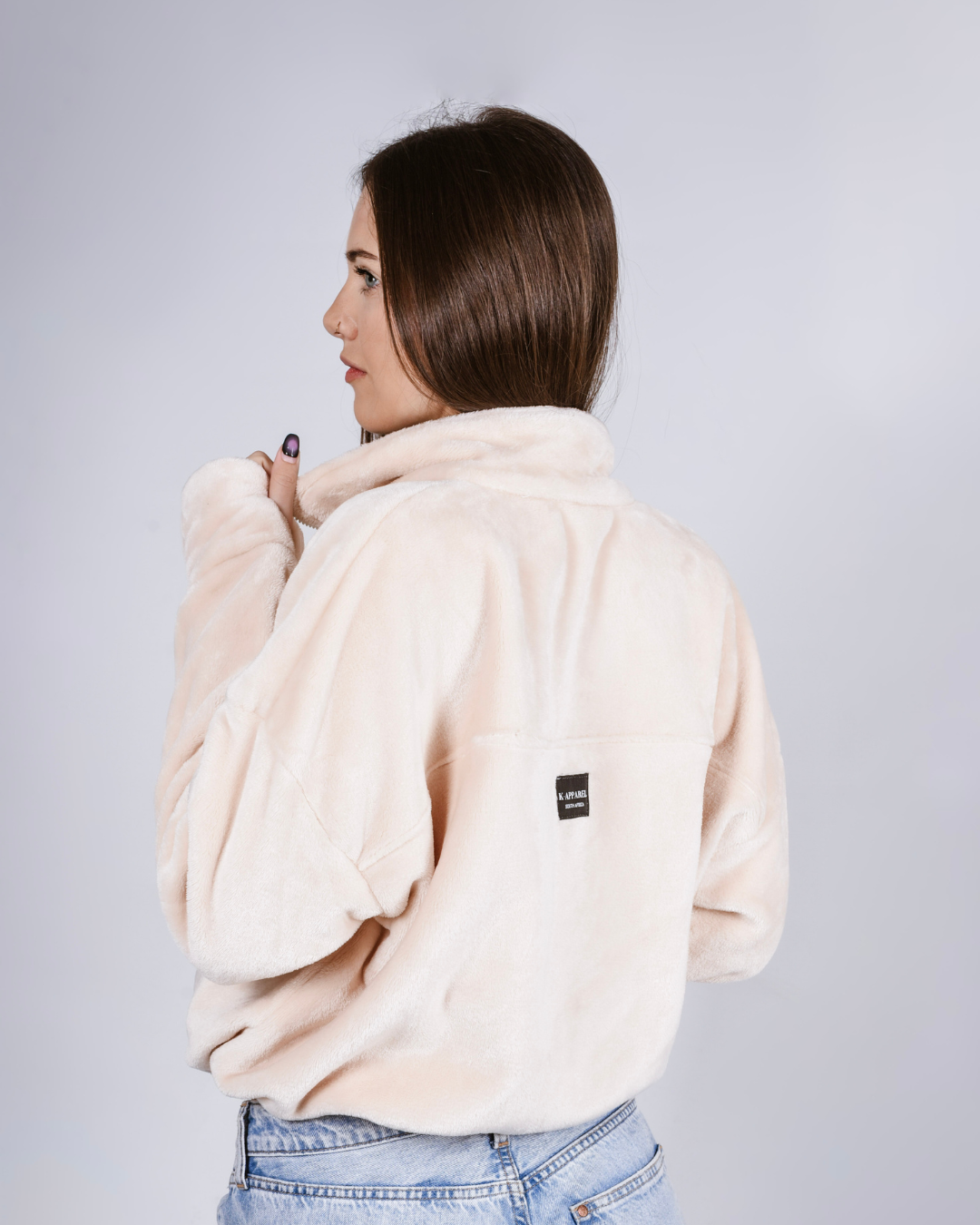 woman wearing a black fluffy jacket with draw cords and thumb holes