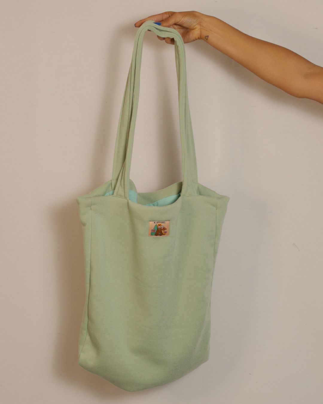 Baby green  tote bag with a patch 