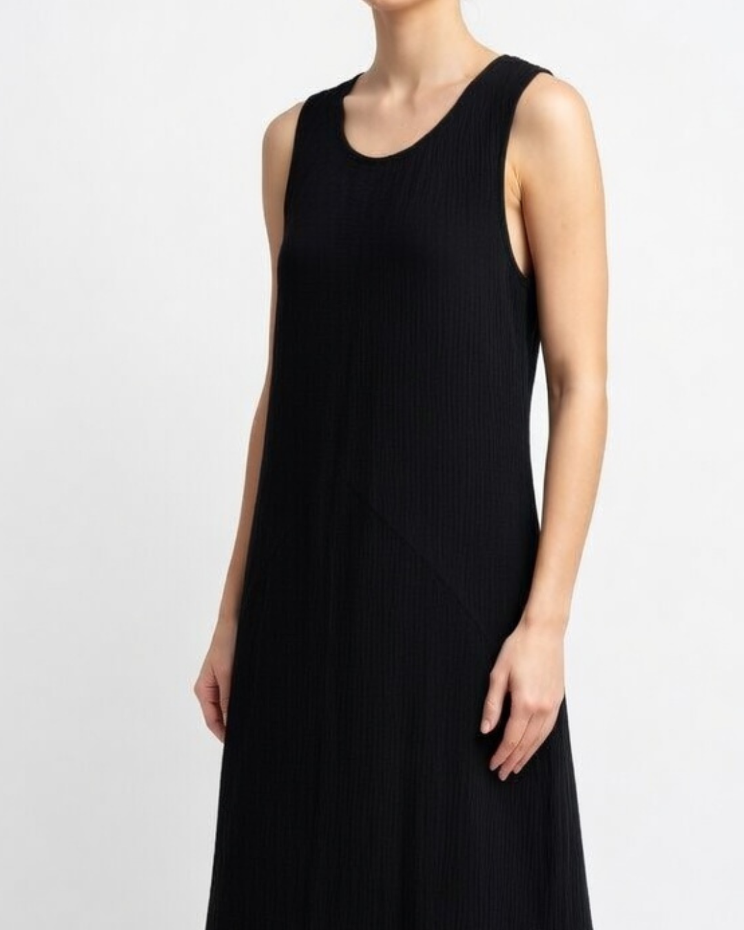 Female wearing a black cotton maxi dress close up 
