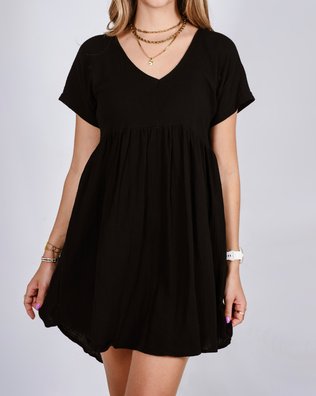 Female wearing a black gumdrop midi dress