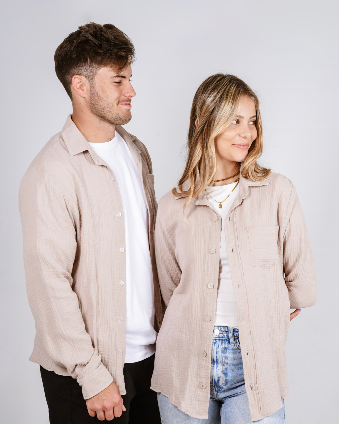 Male and female wearing the Button up cotton shirt in colour beige