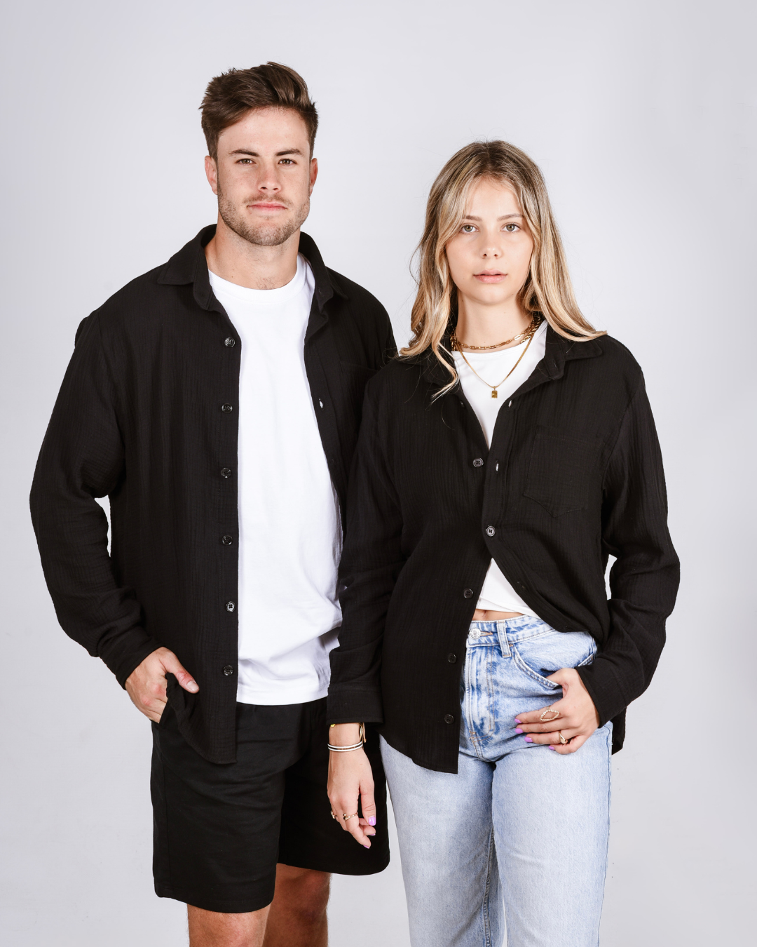 Male and female wearing the Button up cotton shirts in black
