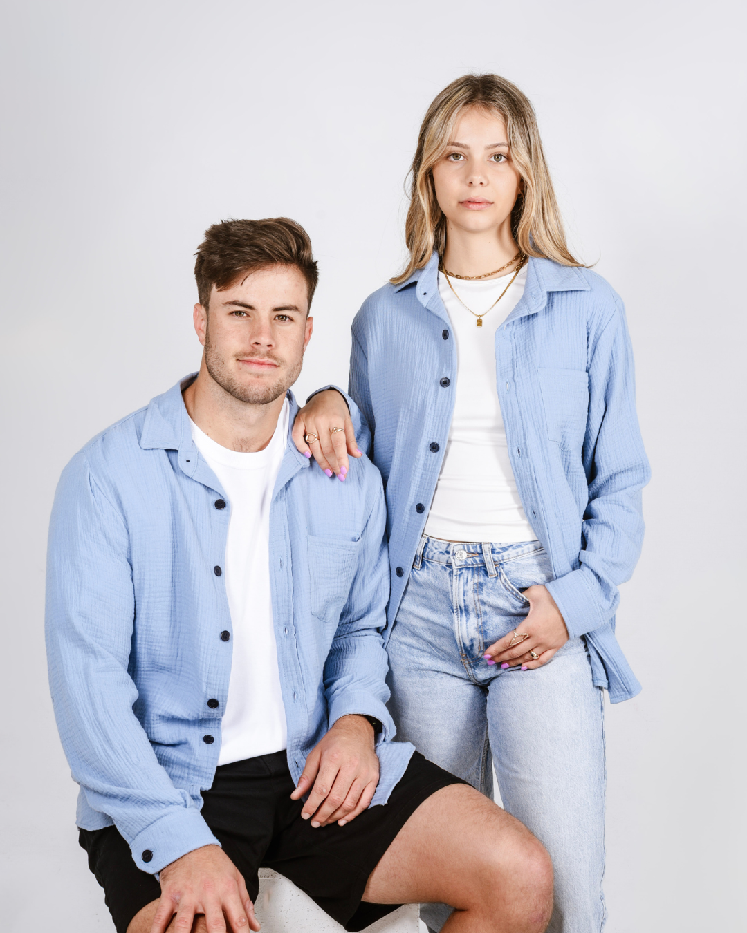 Male and female wearing a Button up cotton shirts in colour blue
