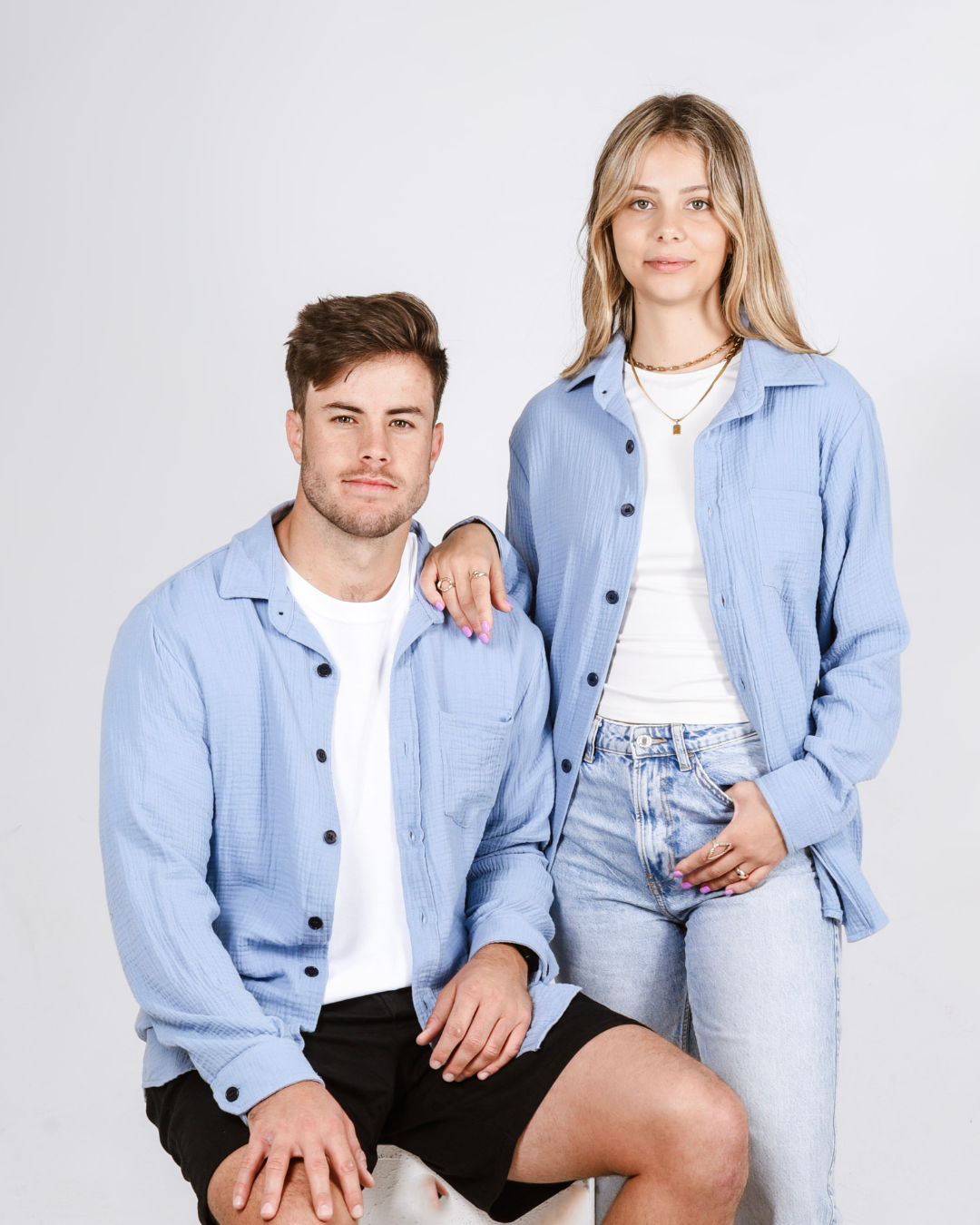Male and female wearing the Button up cotton shirts in colour blue