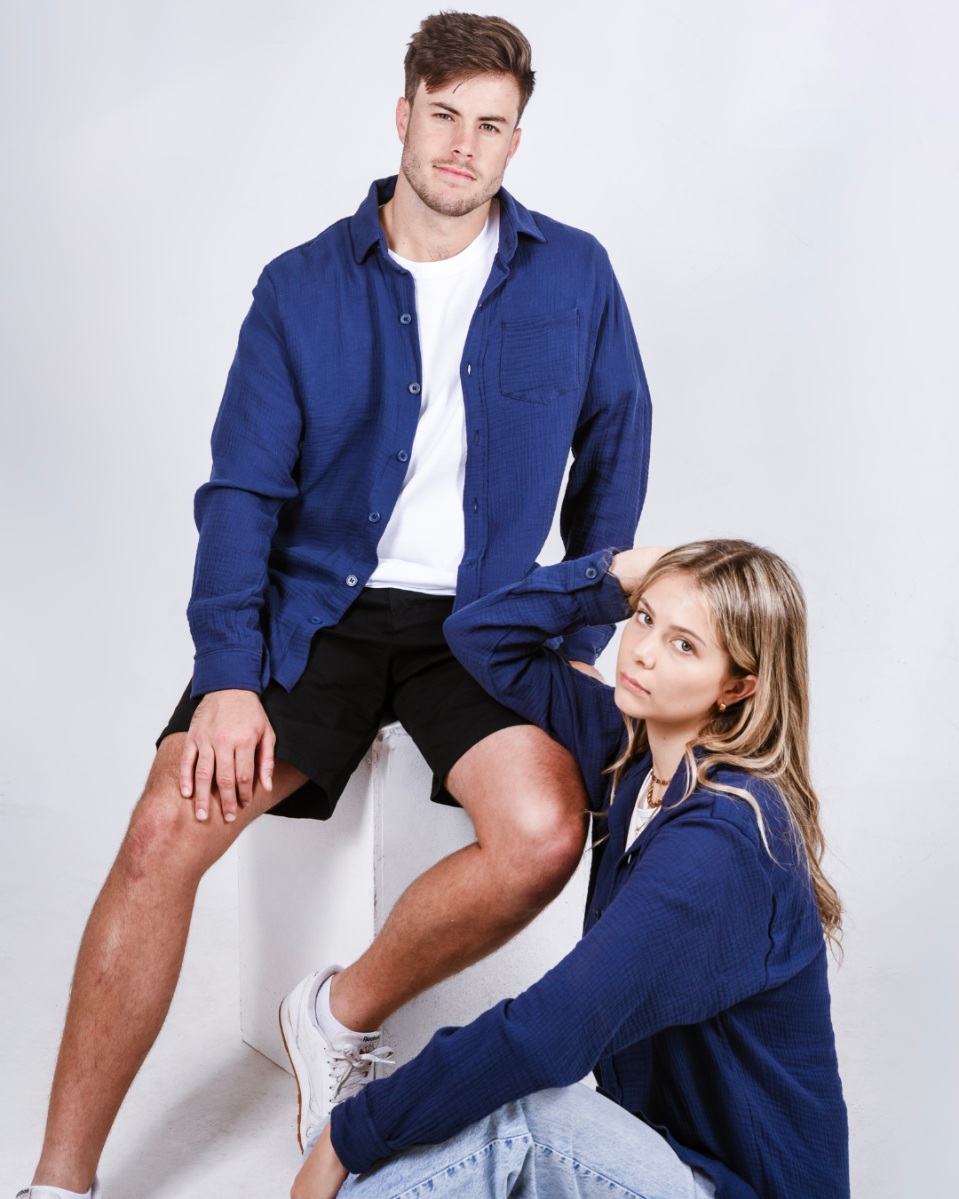 Male and female wearing the Button up cotton shirts in colour navy
