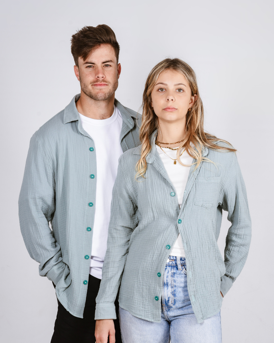 Male and female wearing the Button up cotton shirts in colour teal