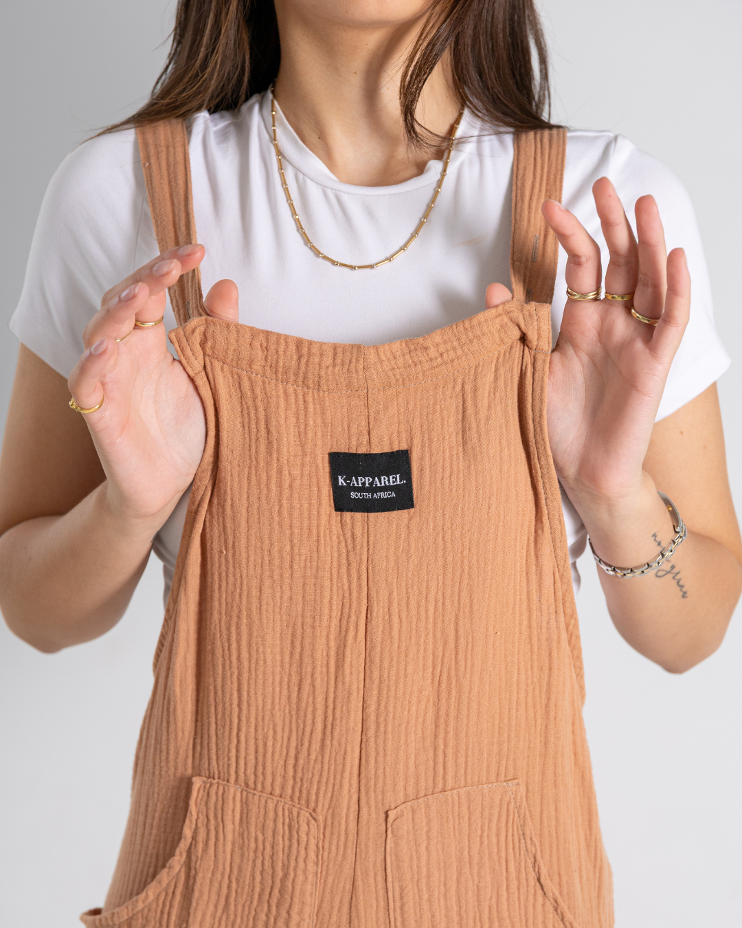 Close up view of coral dungarees