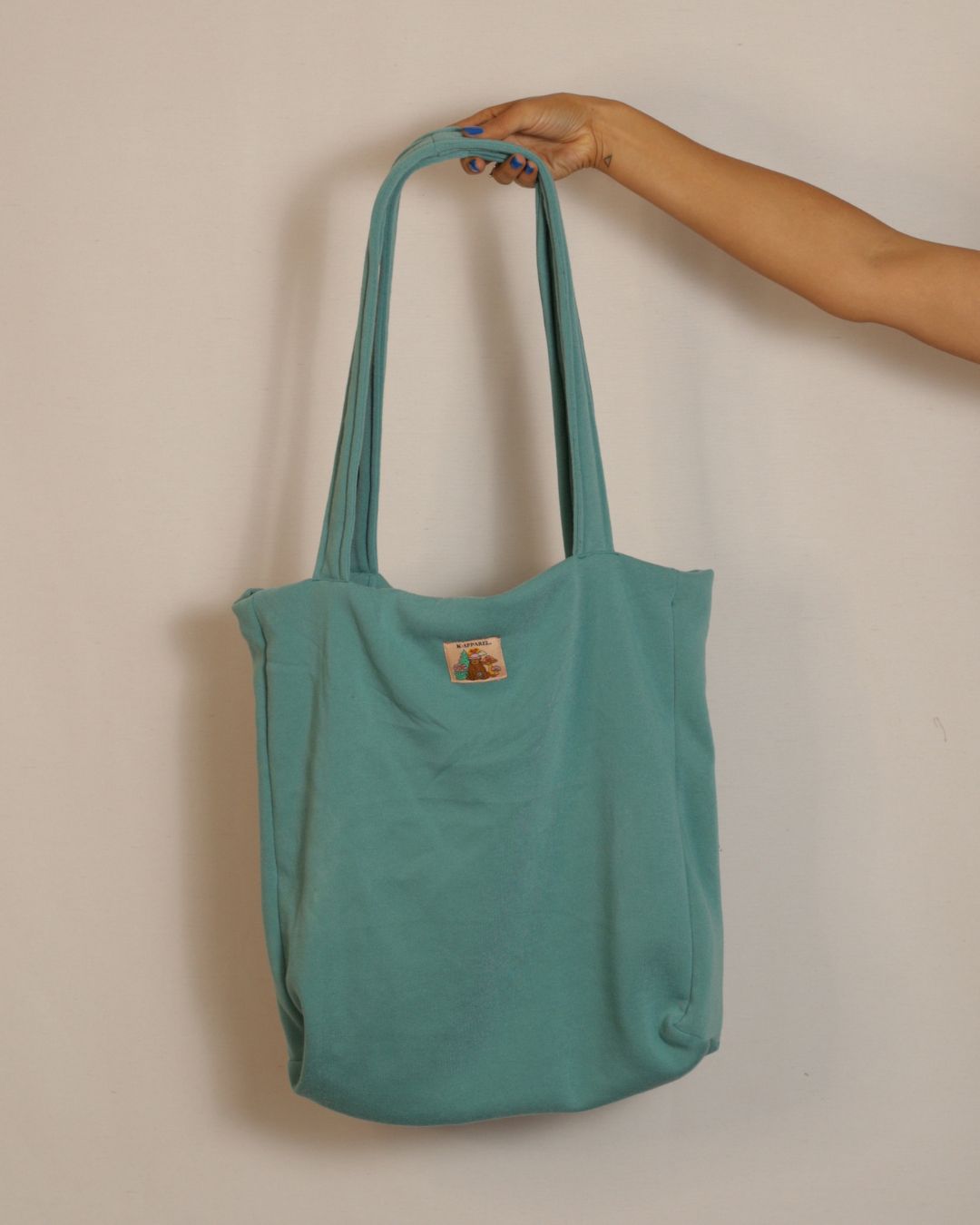 Dark teal  tote bag with a patch 