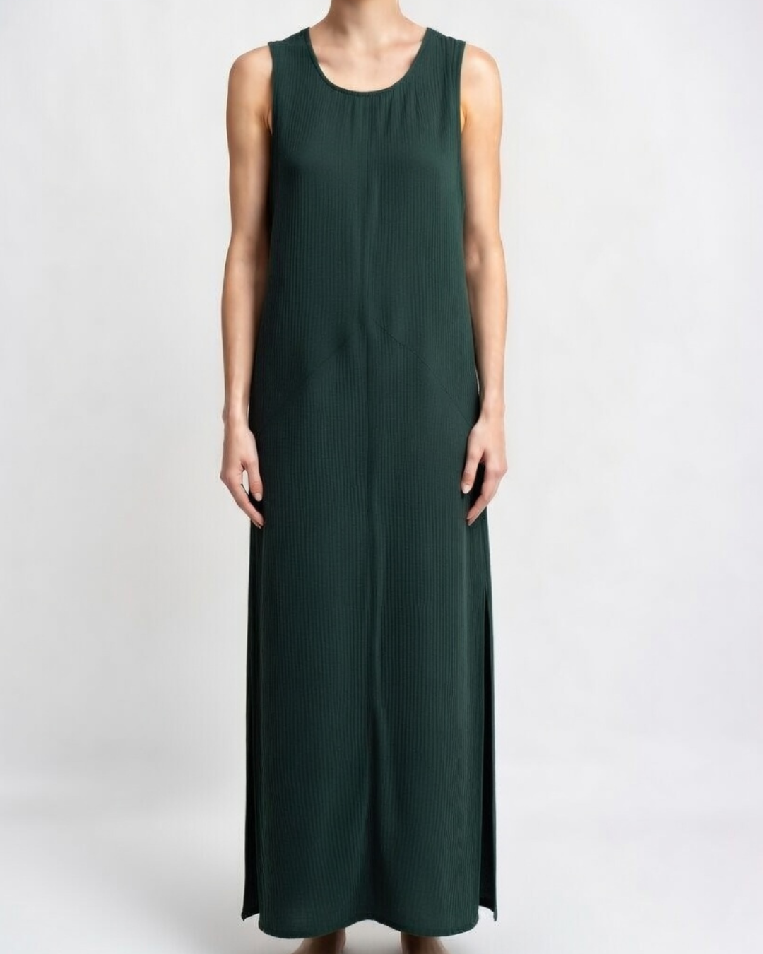 Female wearing an emerald maxi dress