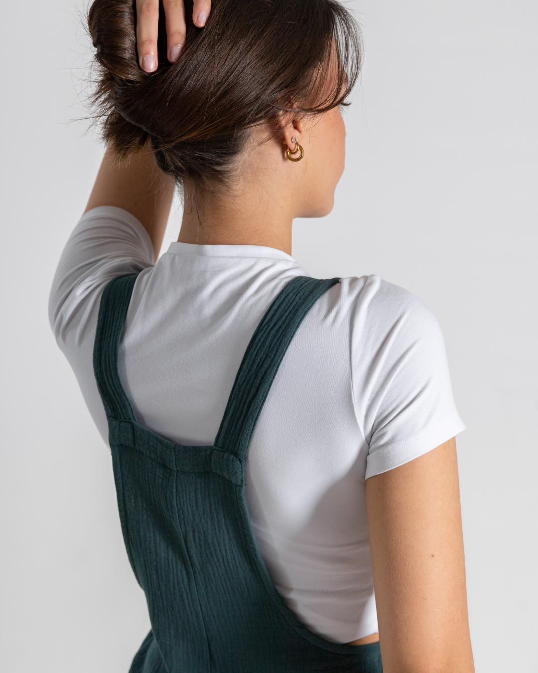 Back of female wearing the green dungaree 
