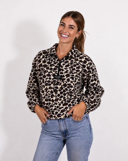 Female wearing a Leopard print quarter zip jersey in studio