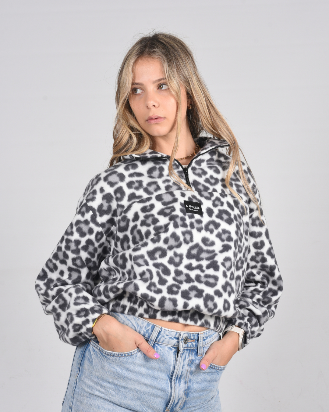 Female wearing a leopard print retro jersey in studio