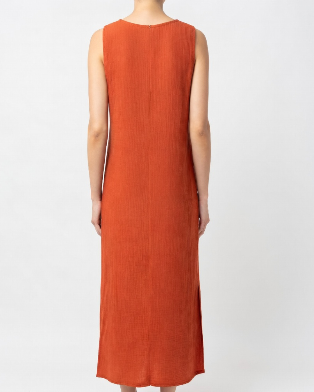 Female wearing an orange cotton maxi dress - back view 