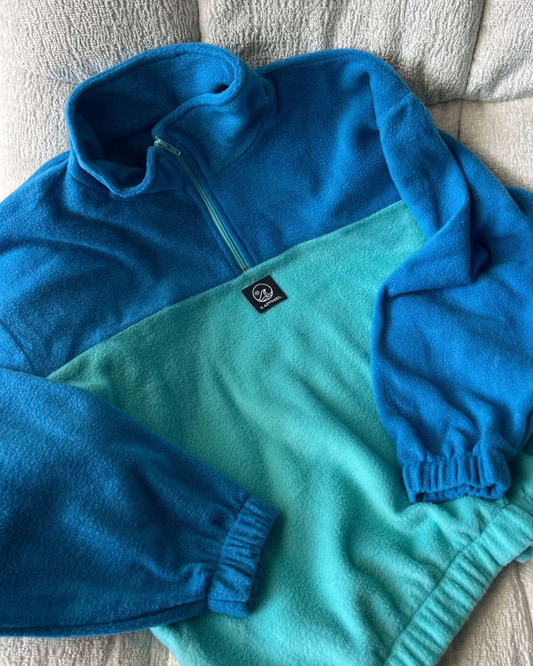 Teal/ blue retro jersey on a chair