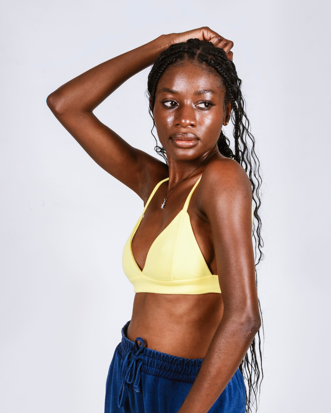 Female wearign a yellow cotton bralette