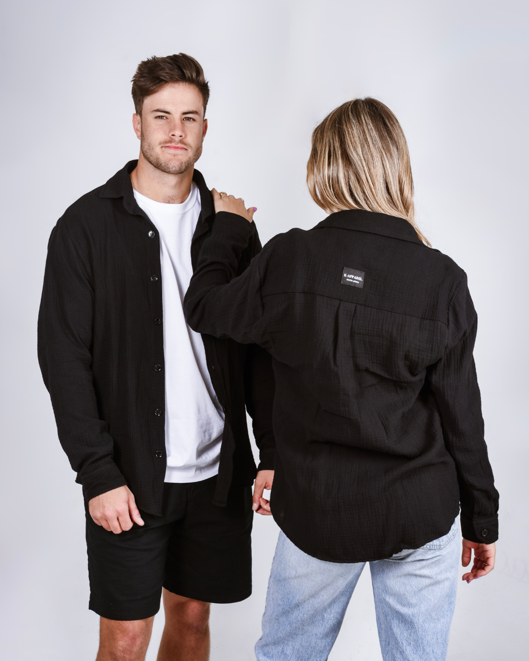 His and Hers button up shirts in the colour black.