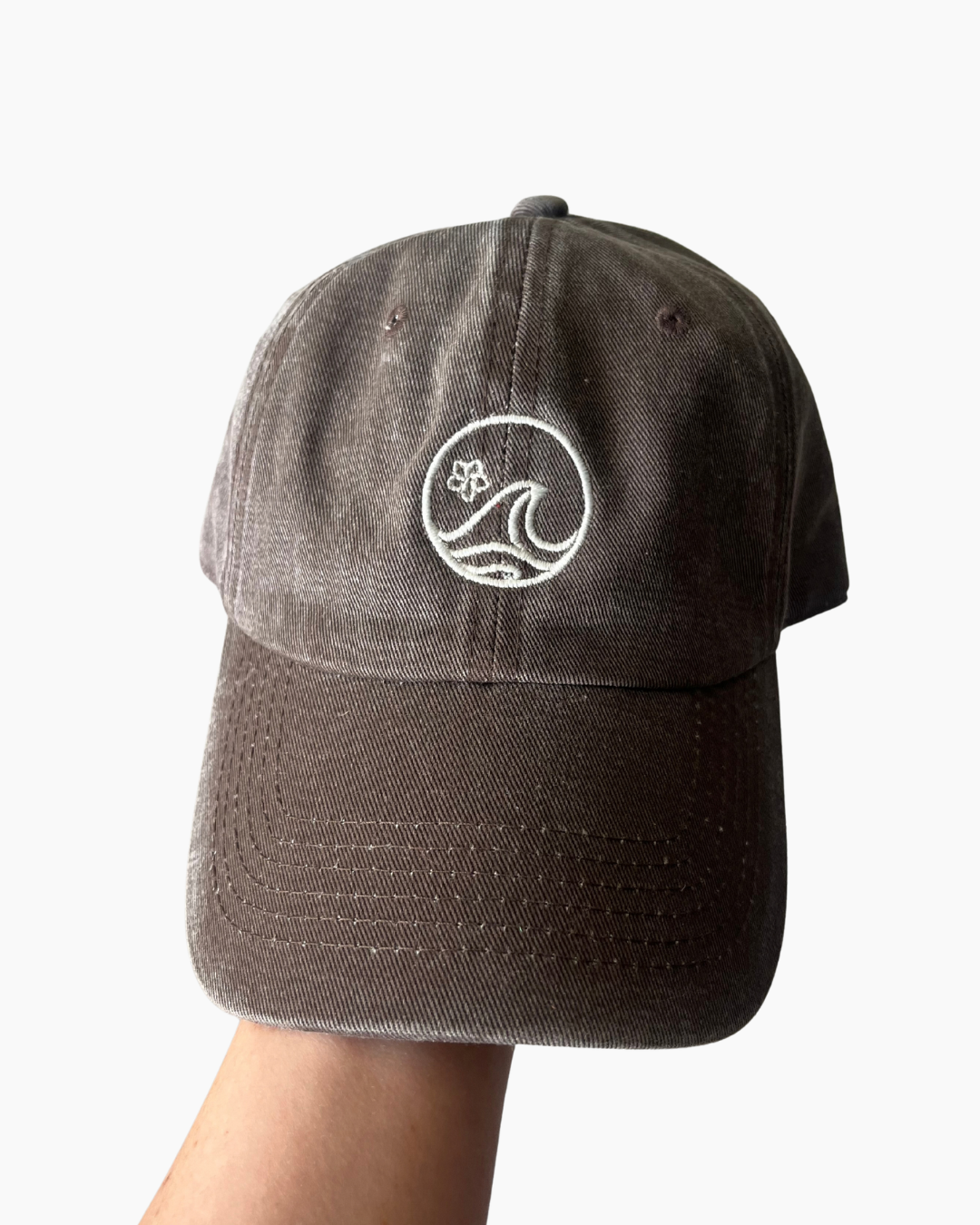 Brown cap with a white K-APPAREL logo