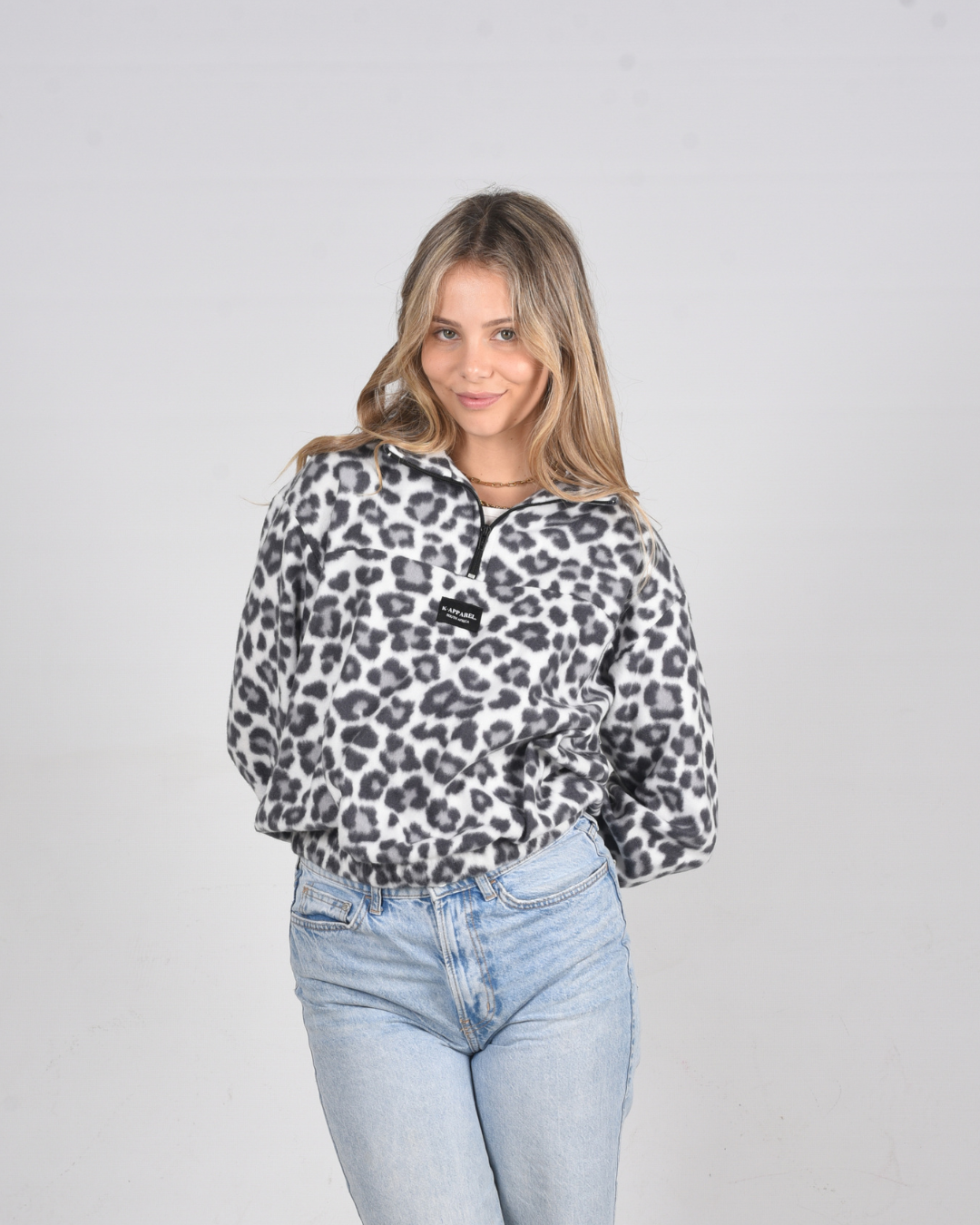 Female wearing a leopard print polar fleece jersey