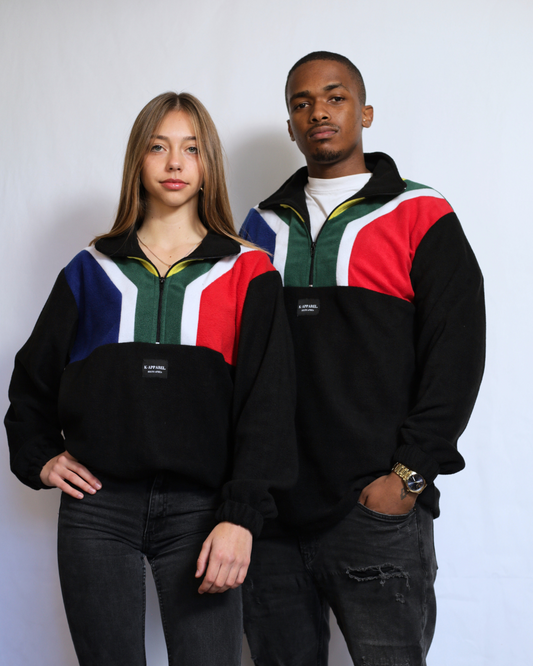 Male and female wearing a black south african flag supporters jersey.